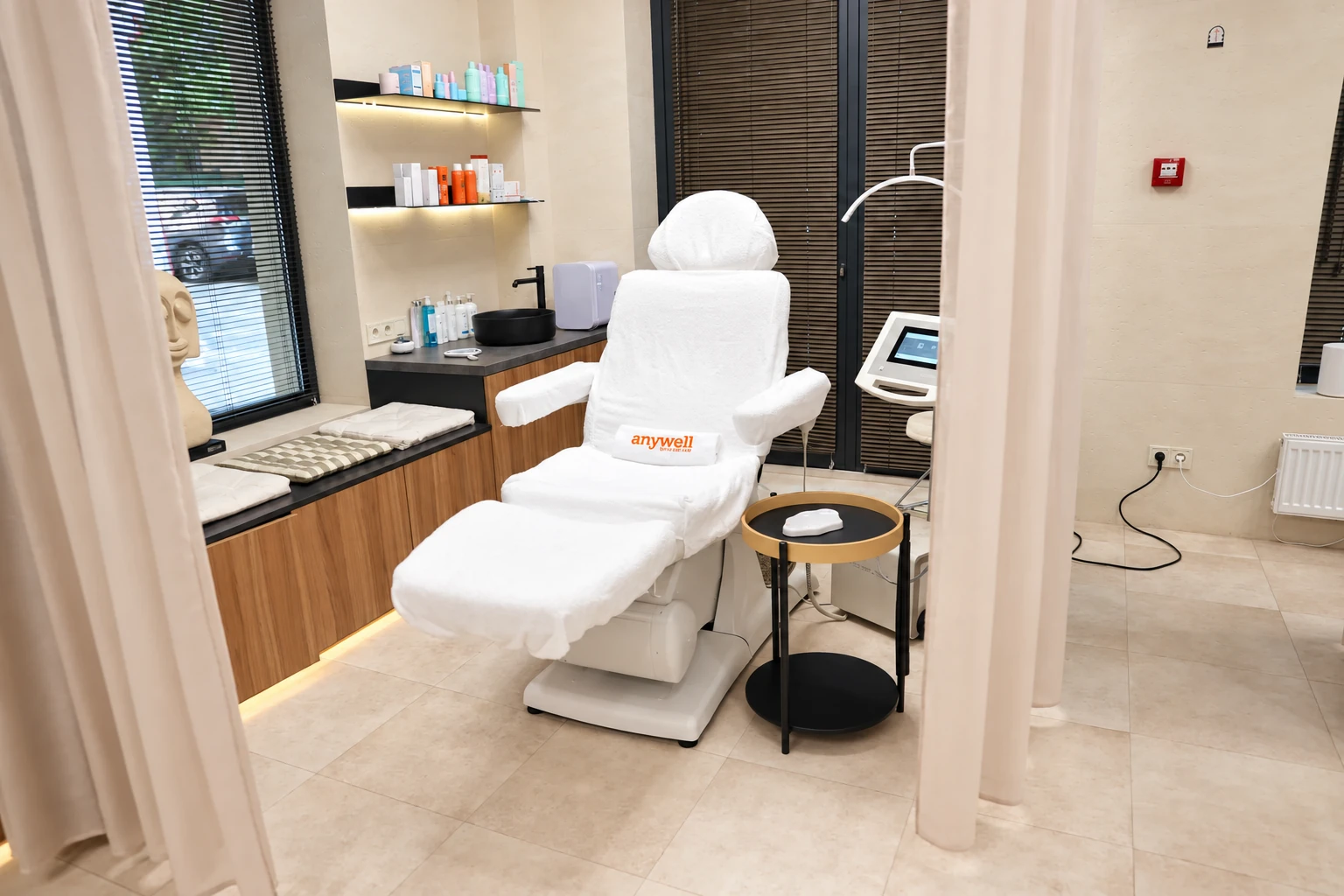 A current Anywell treatment room with a reclining care chair and professional equipment